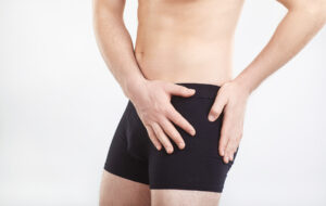 Athletic man experiencing hip pain