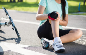 Woman with an acute sports injury after falling off her bicycle